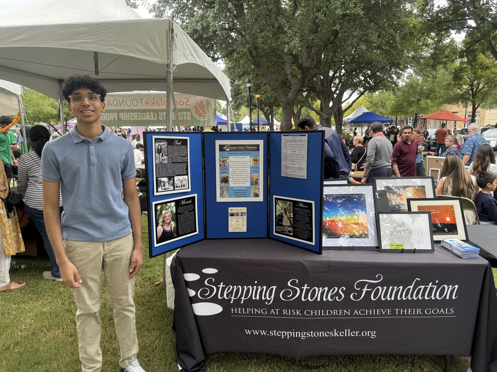 The AIGC table of framed prints at a community fundraiser